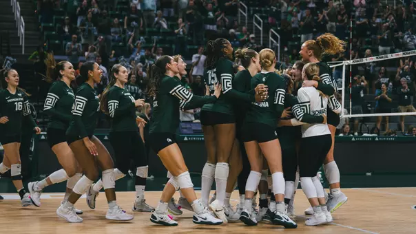Volleyball team celebration vs. Miami