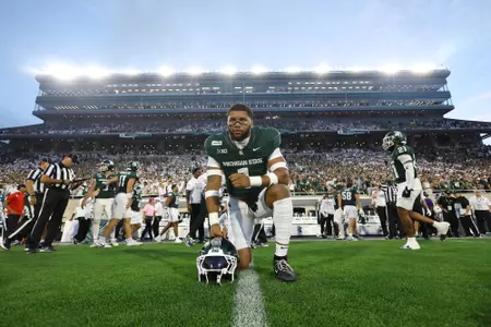 Kenny Soares Jr. takes a moment before the season opener before Toledo.