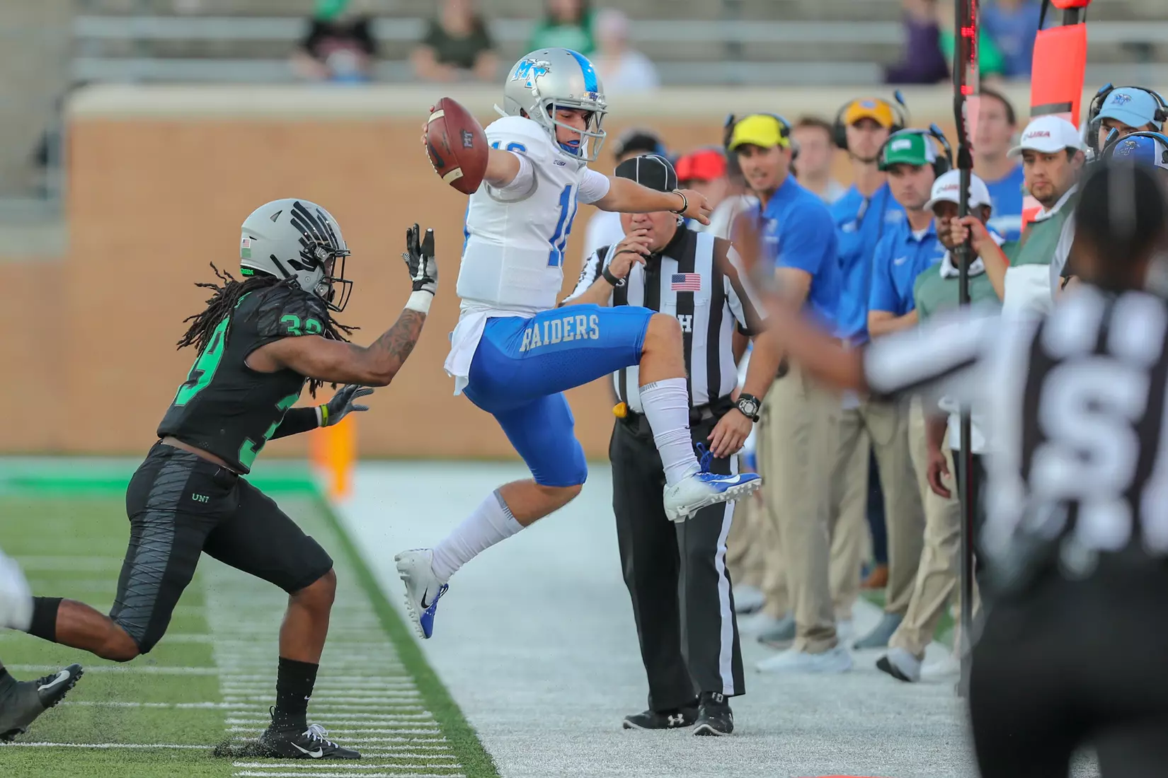 Cunningham reaching for first down marker