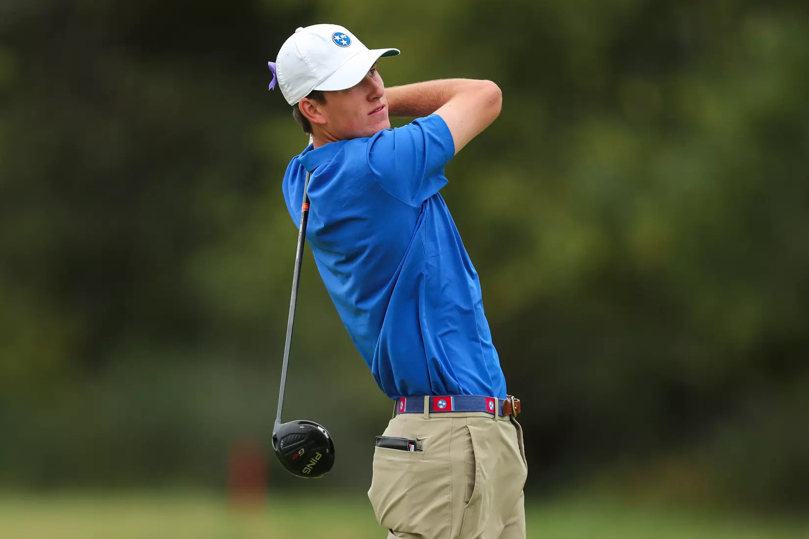golfer standing with club