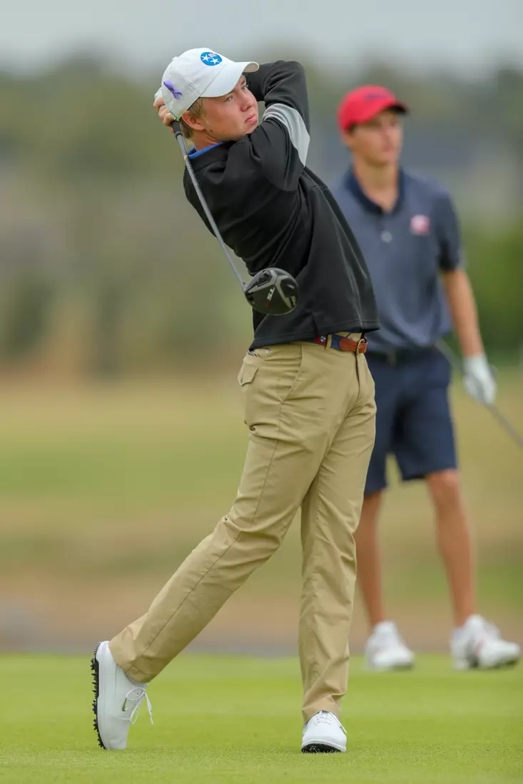 golfer standing with club