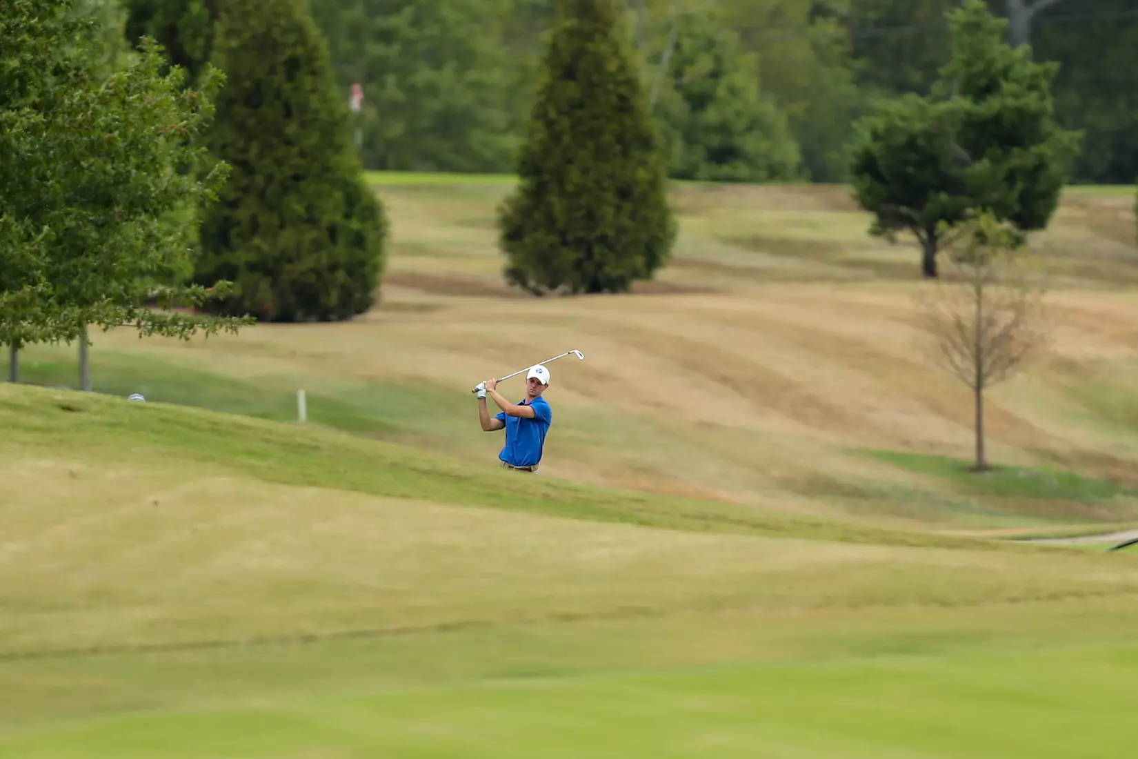 golfer standing with club