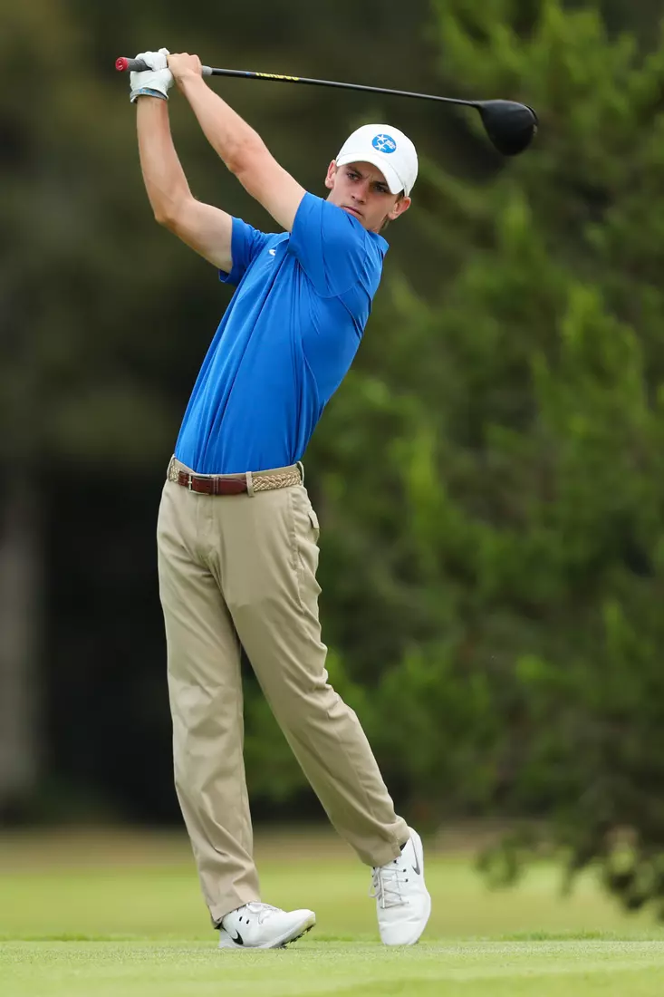 golfer standing with club