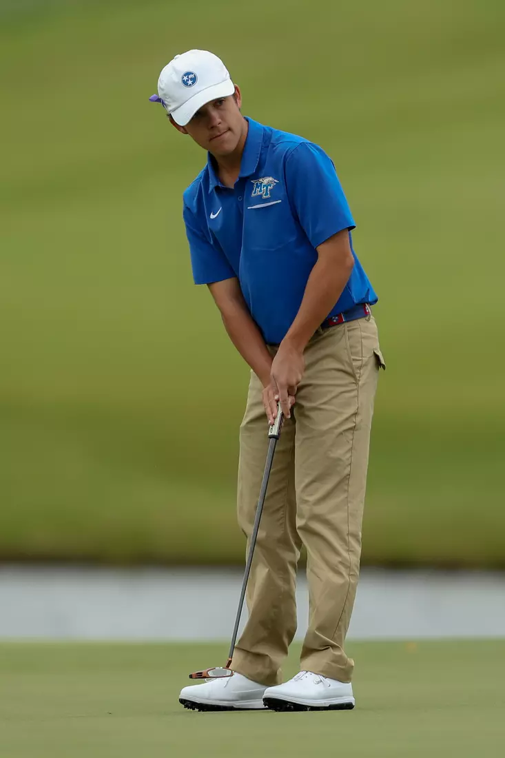 golfer standing with club