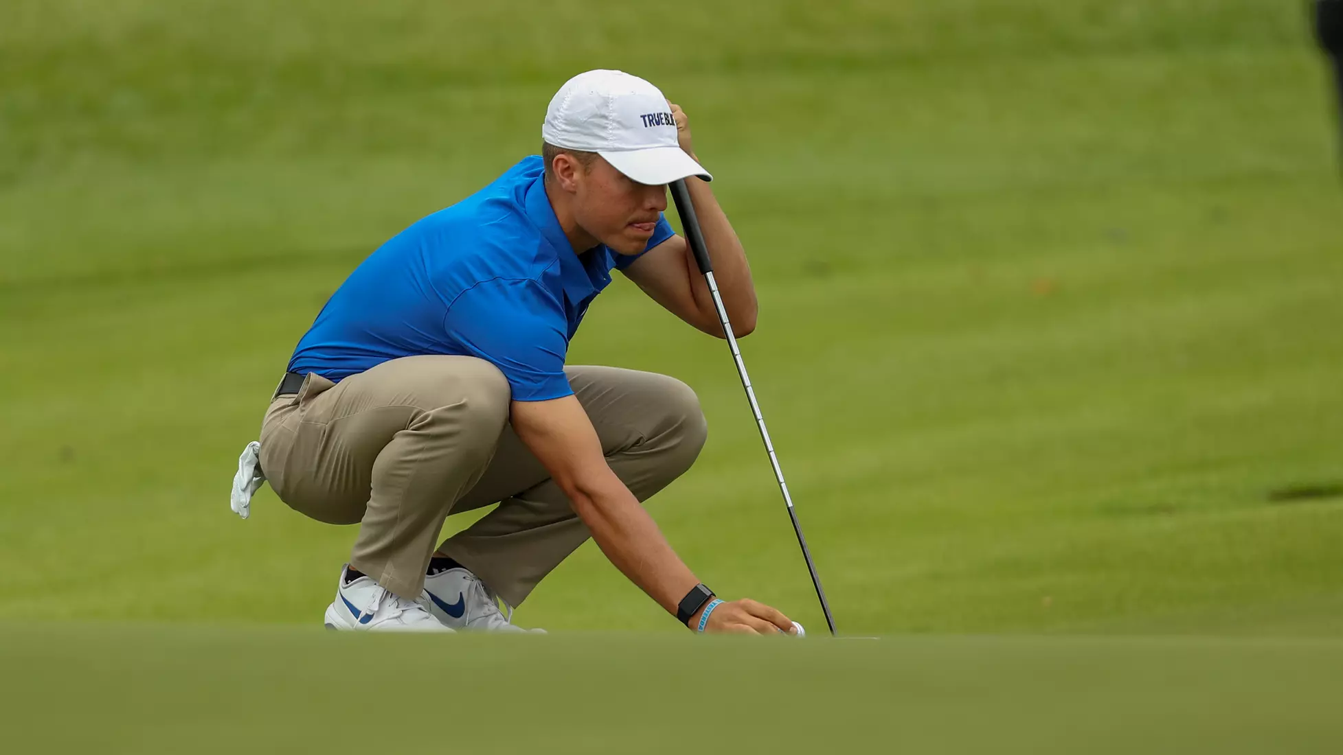 golfer standing with club