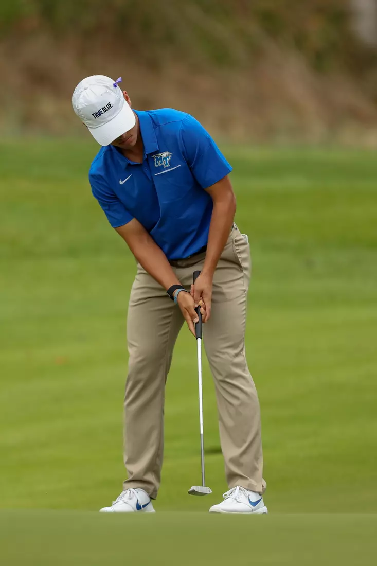golfer standing with club