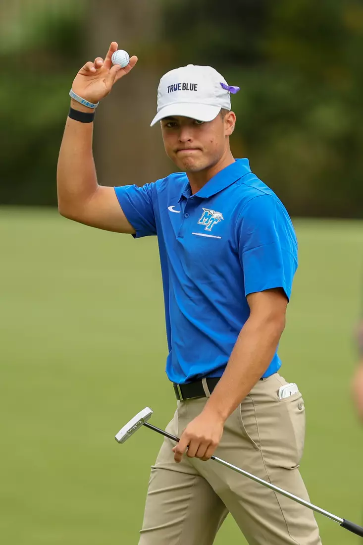 golfer standing with club