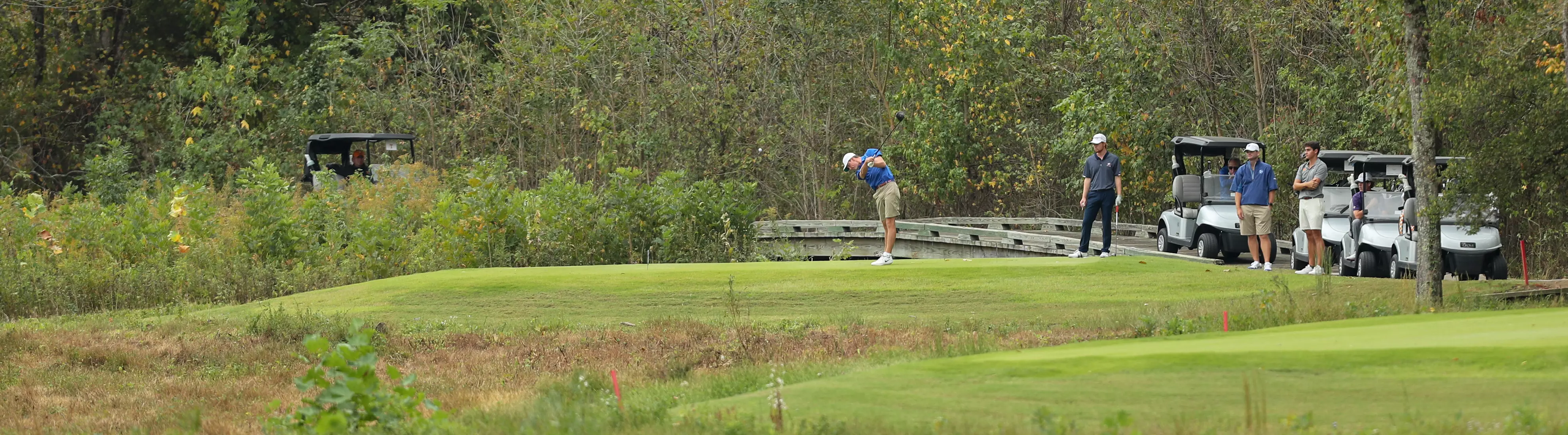golfer standing with club