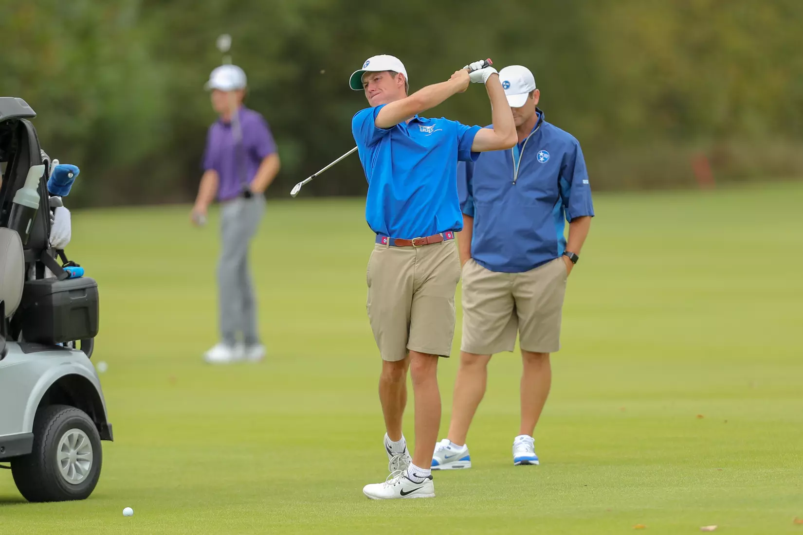 golfer standing with club