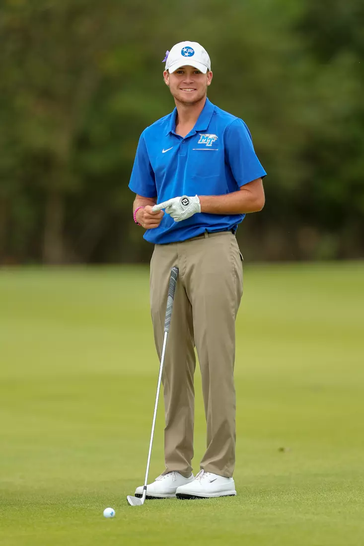 golfer standing with club