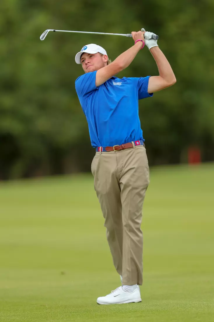 golfer standing with club