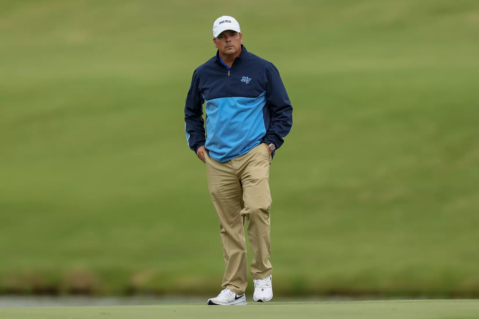 golfer standing with club