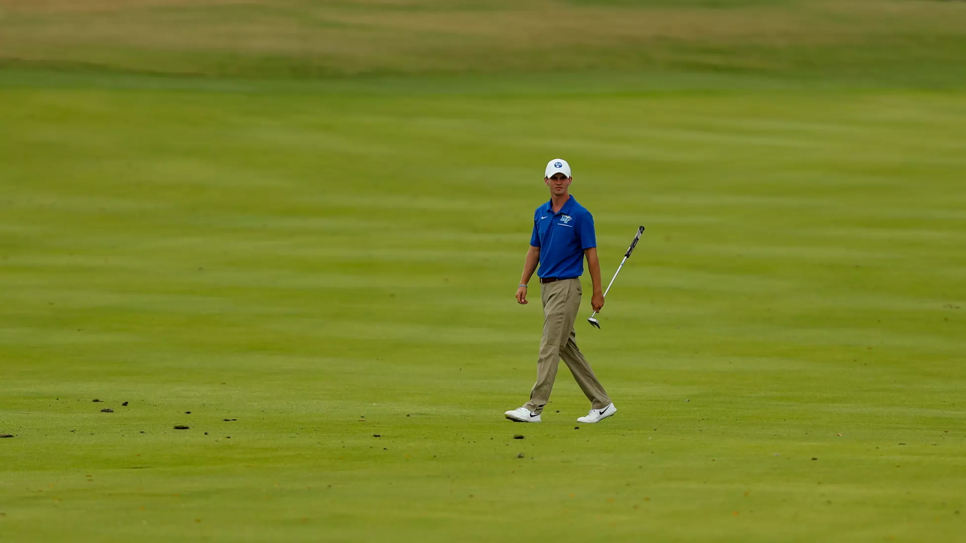 golfer standing with club