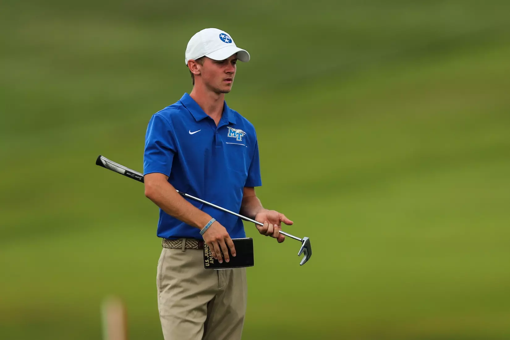 golfer standing with club