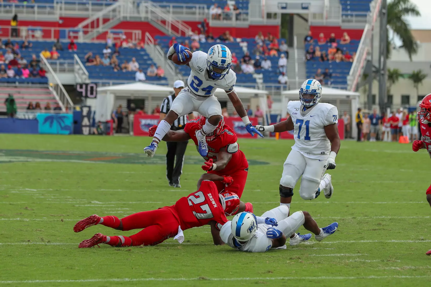 Dobson jumps over defender