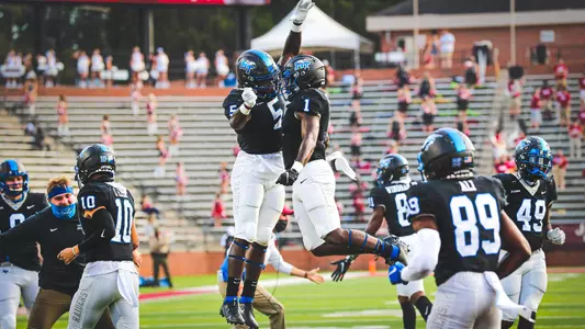 Chaton Mobley and Frank Peasant chest bump