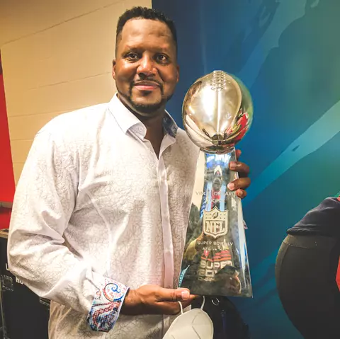 Inside Linebackers Coach Mike Caldwell of the Tampa Bay Buccaneers with the Vince Lombardi Trophy after Super Bowl LV