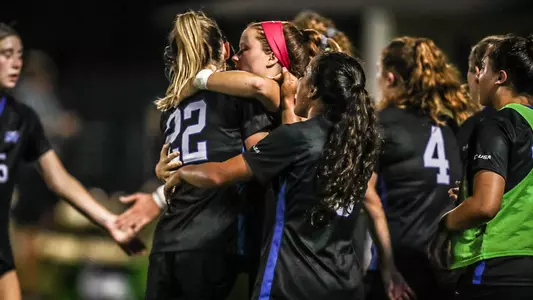 DePriest and Taylor hugging vs. Vanderbilt