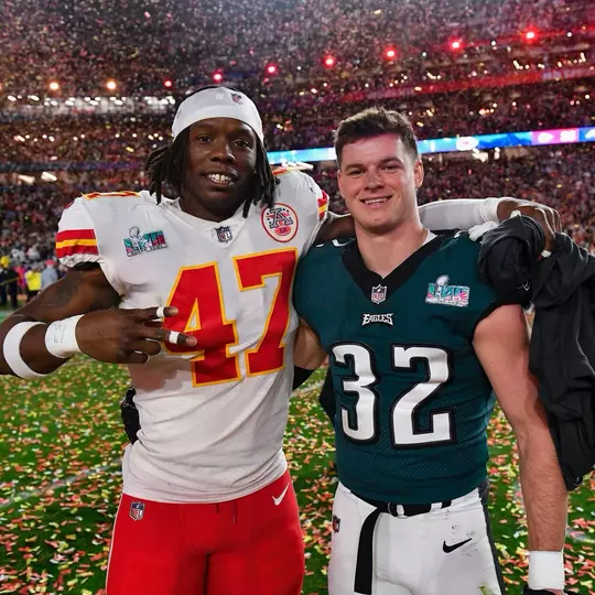 Kansas City Chiefs linebacker Darius Harris (47) poses with Philadelphia Eagles safety Reed Blankenship (32) after winning the Super Bowl LVII football game on Sunday, February 12, 2023 in Glendale, Arizona. (Alika Jenner/NFL)