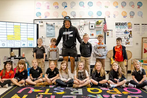 Elijah Carney, a senior philosophy and religious studies major at Middle Tennessee State University in Murfreesboro, Tenn., and linebacker for the Blue Raiders football team takes a photo with students from Middle Tennessee Christian School in Murfreesboro during Read Across America Week. During the visit, Carney read books to the children and emphasized the importance of reading. (Submitted photo)
