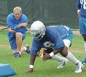 Andy McCollum looks on as defe...