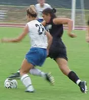 MT's Sarah Linder (28) battle...