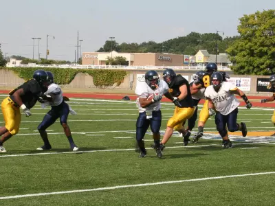Football Conducts First Scrimmage Image