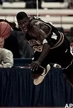 Tajudeen Soyoye drives<br>around a defender<br>after hauling in a defensive<br>rebound on Friday night.