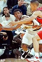 Missouri's Keyon Dooling looks for help around Southern Methodist's Damon Hancock during the first half Wednesday.