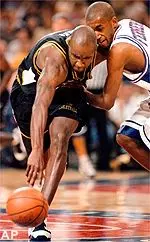 Missouri's Johnnie Parker wrestles the ball away from Saint Louis' Dave Fergerson in the first half Sunday.