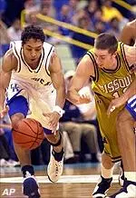 Brian Grawer and Kentucky's Saul Smith fight for the ball in first half action Thursday night.