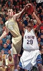 Jeff Hafer blocks a shot<BR>by Kansas guard Kenny Gregory<BR>during Sunday's game.