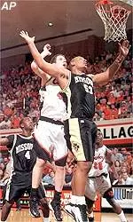 Monte Hardge battles with <br>Oklahoma State's Alex Webber<br> for a rebound during <br>their game Saturday.
