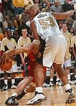 Monte Hardge defends<BR>against an Iowa State player<BR>during Wednesday's game.