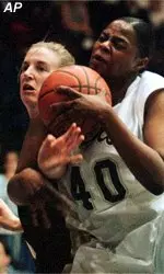 Amy Monsees fights a<BR>Baylor player for possession<BR>during Tuesday's game.