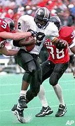Missouri's Tiger Wade Perkins <br>is tackled by Texas Tech <br>defenders during Sat.'s 28-26 win.