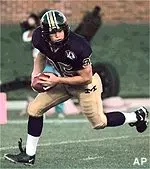 Punter Jared Gilpin looks<br>for room to run after<br>recovering the football<br>following a high snap<br>from the center during<br>the first quater against<br>Nebraska Saturday.