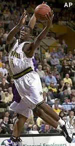 Missouri's Keyon Dooling flies past Kansas State's Josh Kimm during the second half on Saturday.