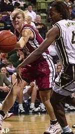 Ekpe Akpaffiong and Oklahoma's Jadrea Seely try to stop a ball from going out of bounds in the first half Saturday.