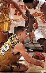 Iowa State's Michael Nurse and Missouri's Brian Grawer battle for a loose ball during the first half Saturday.