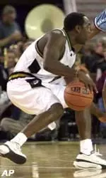 Missouri's Clarence Gilbert has his path to the basket blocked by Rhode Island's Zach Marbury.