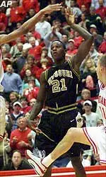 Kareem Rush, shown here being fouled by IU's Jared Jeffries, led the Tigers with 18 points in MU's 68-63 victory Monday night.