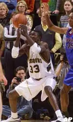 Missouri's Tajudeen Soyoye (33) loses control of the ball in front of DePaul's Steven Hunter (45).