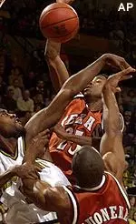 Missouri's Johnnie Parker, left, blocks the shot of Texas' Darren Kelly during Saturday's 66-63 loss.