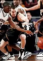 Kansas State's Kenyatta Dix battles Missouri's Jeff Hafer for a loose ball in the first half Saturday.