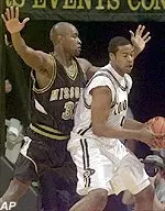 Missouri forward Johnnie Parker defends Colorado forward Jamahl Mosley during Missouri's 86-81 win, Wednesday.
