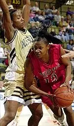 Ekpe Akpaffiong stopsTexas Tech's Aleah Johnson as she attempts to drive to the basket in the first half of Tuesday's game.