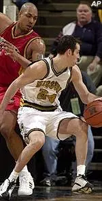 Jeff Hafer dribbles around Iowa State's Marcus Fizer during Wednesday's game against the Cyclones.