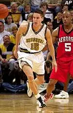 Missouri's Josh Kroenke hustles back to get a loose ball ahead of Nebraska's Larry Florence.