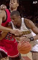 Missouri's Keyon Dooling drives past Texas Tech guard Ronald Hobbs during the Tigers' 80-47 victory, Thursday.